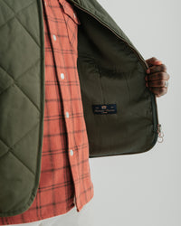 main MEN'S SPRUCE GREEN QUILTED VEST